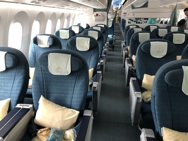 Vietnam Airlines Economy Class cabin with blue seats on a Boeing 787